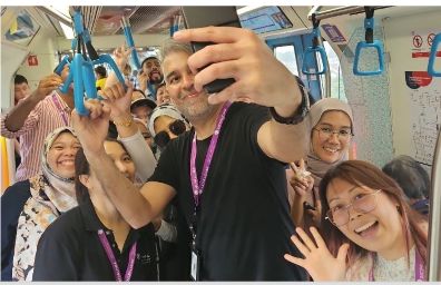 A team celebrating during the Malaysian Cultural Snaprunner race